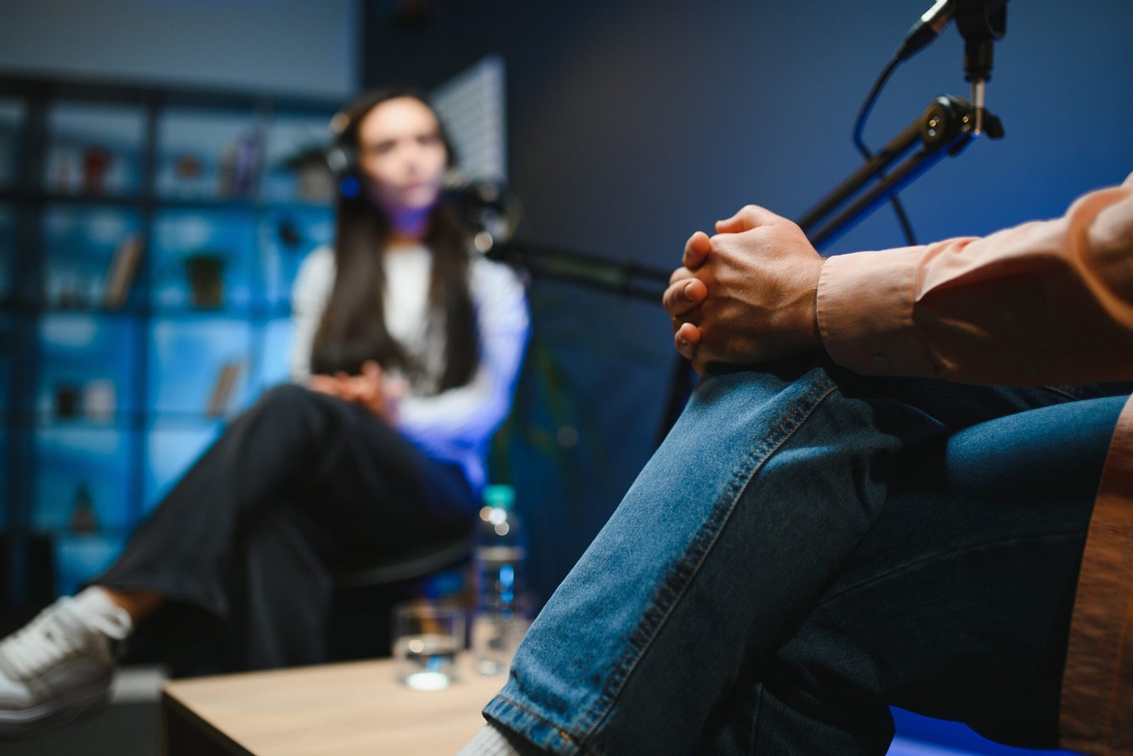 show host interviewing woman during live stream, talking about fashion and style trends, disagreeing with her opinions. man arguing with social media celebrity, recording podcast